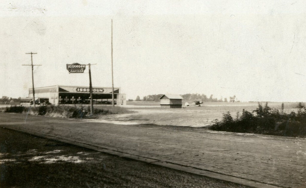 Mid City Airport. View of Issoudun Canteen. Small biplane visible in background