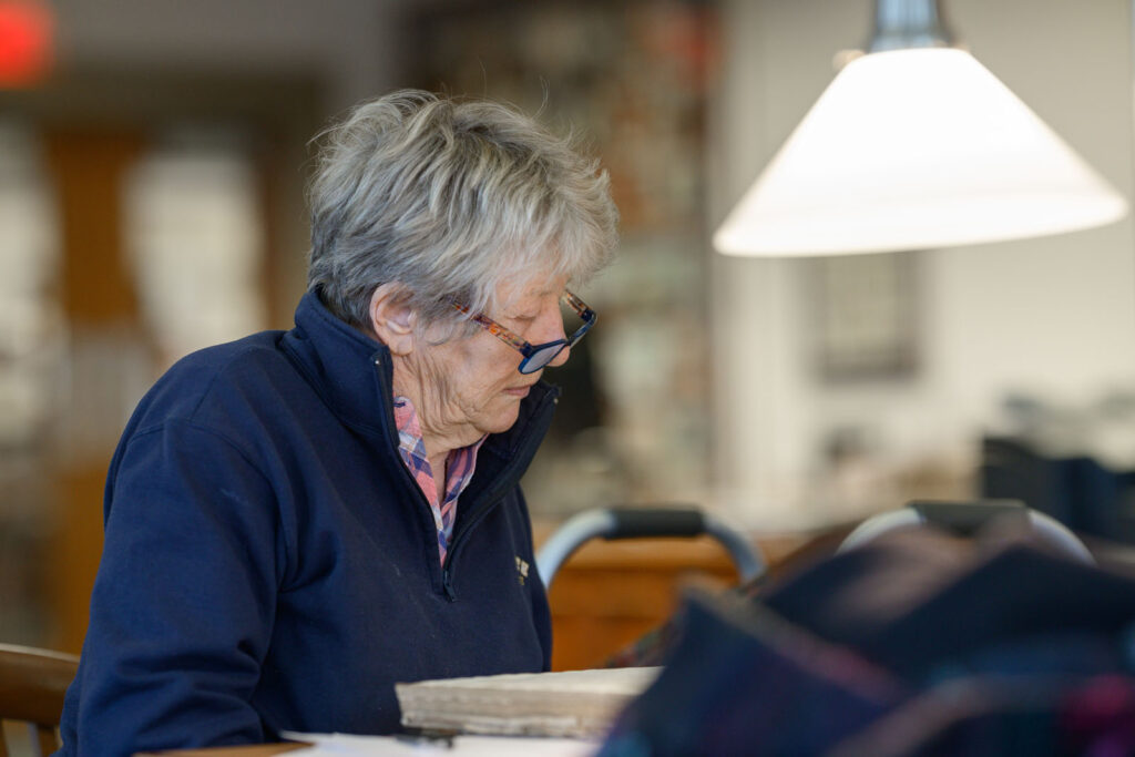 Researcher reading at table