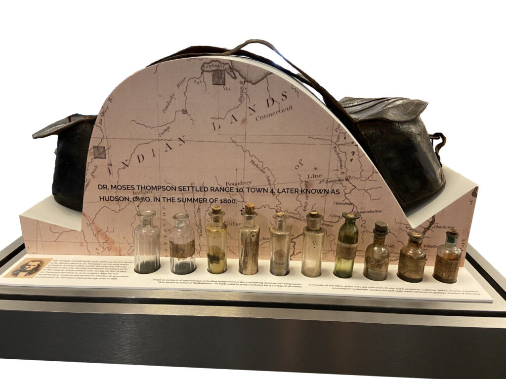 Moses Thompson saddlebags on display, with medicine bottles